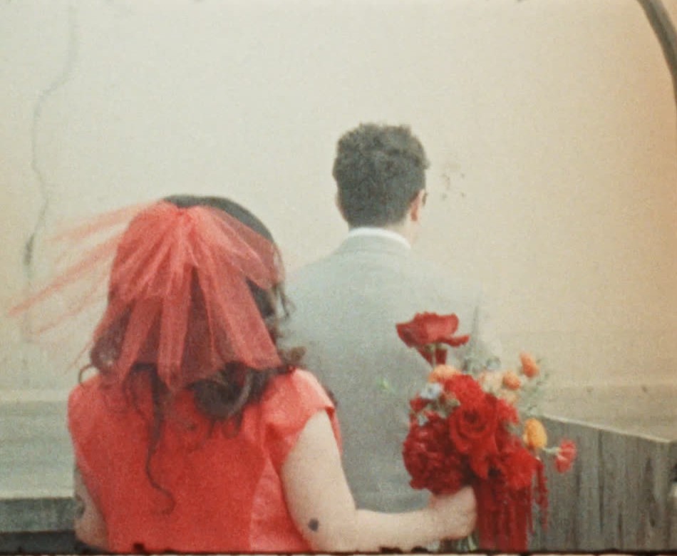 Couple from behind holding a bouquet, Super 8 still